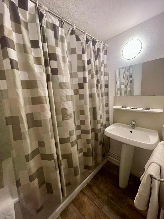 Koupelna v ubytování Hotel Alexander