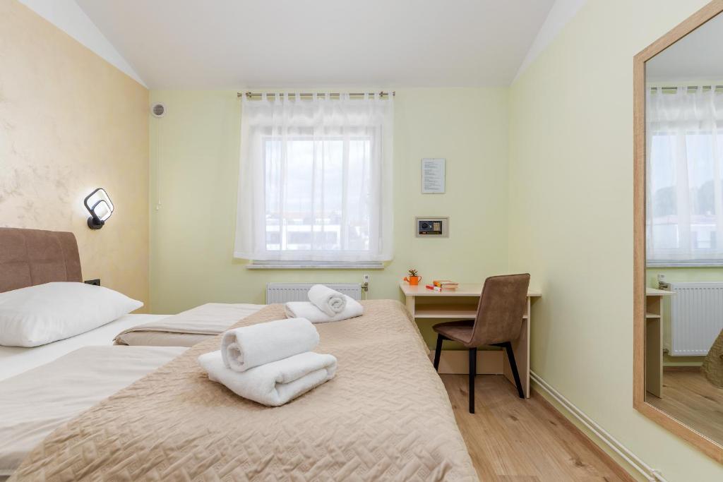 Łóżko lub łóżka w pokoju w obiekcie Apartments Ana-Maria