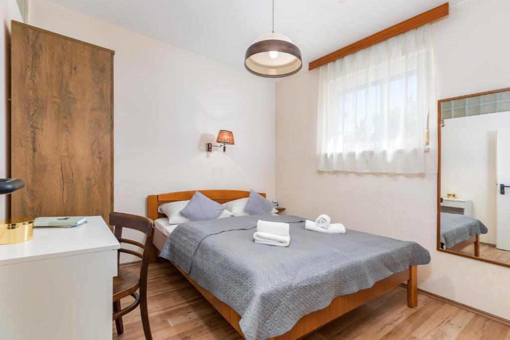 Łóżko lub łóżka w pokoju w obiekcie Apartments Ana-Maria