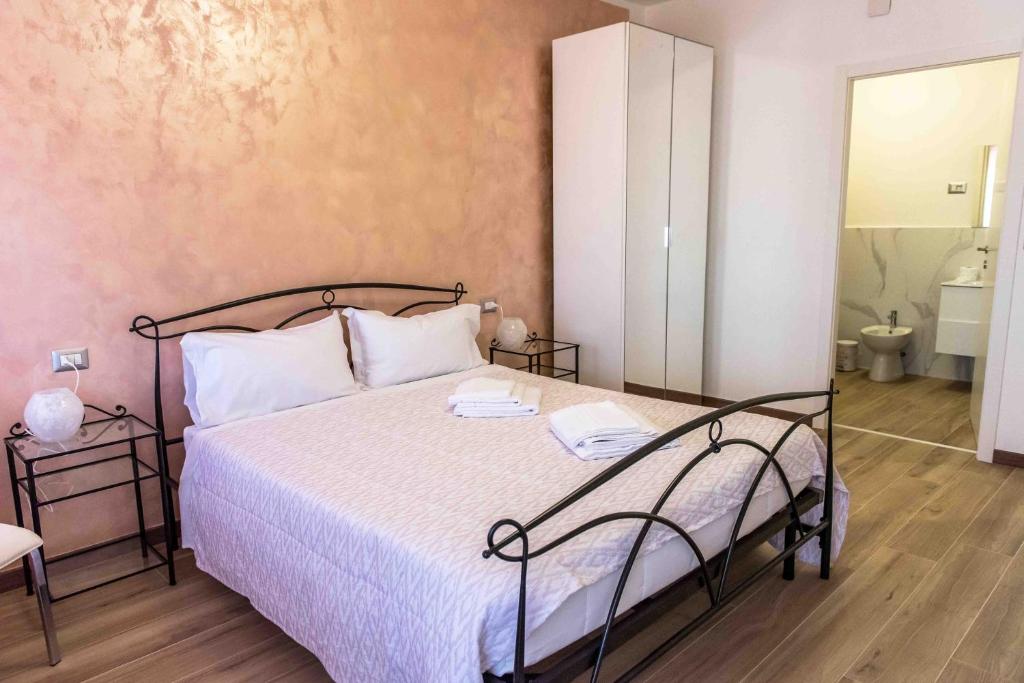 Postel nebo postele na pokoji v ubytování Da Nat Apartment