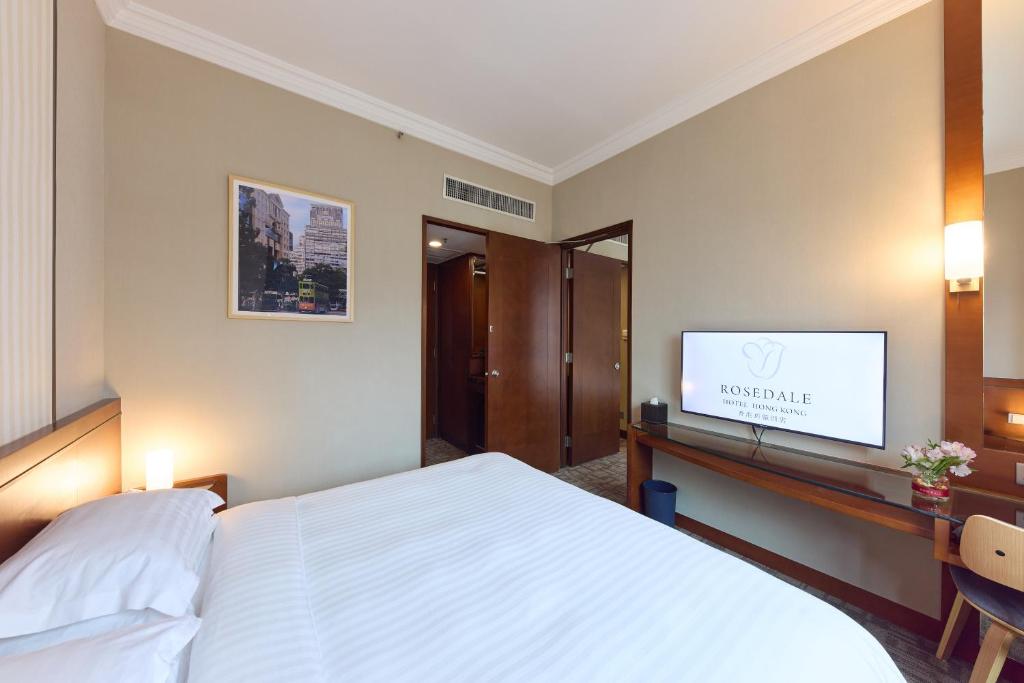 Ein Bett oder Betten in einem Zimmer der Unterkunft Rosedale Hotel Hong Kong