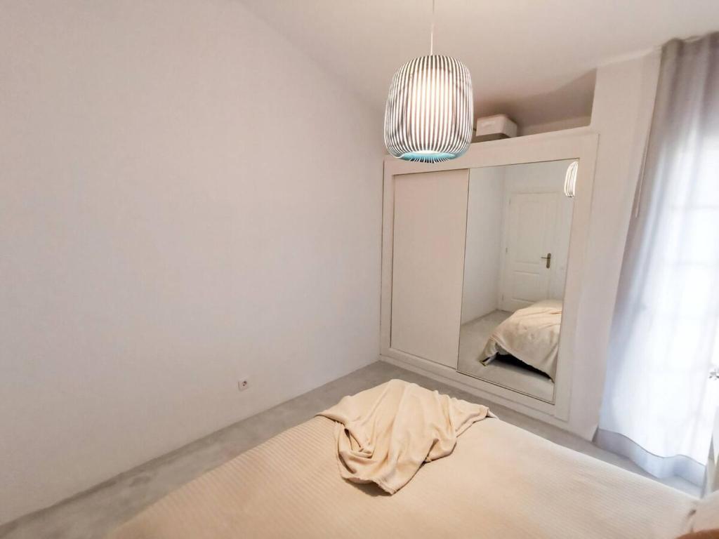 Łóżko lub łóżka w pokoju w obiekcie Apartament Tisalaya 44 By Pride Holiday Rentals