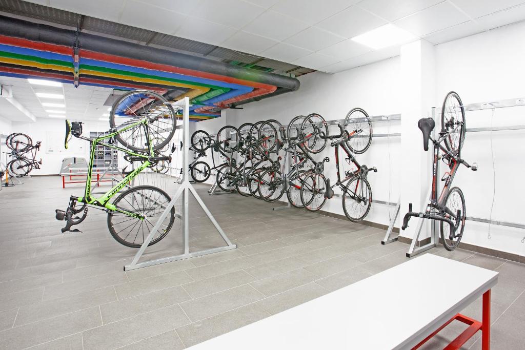 a room with a bunch of bikes on racks at Grupotel Parc Natural & Spa in Playa de Muro