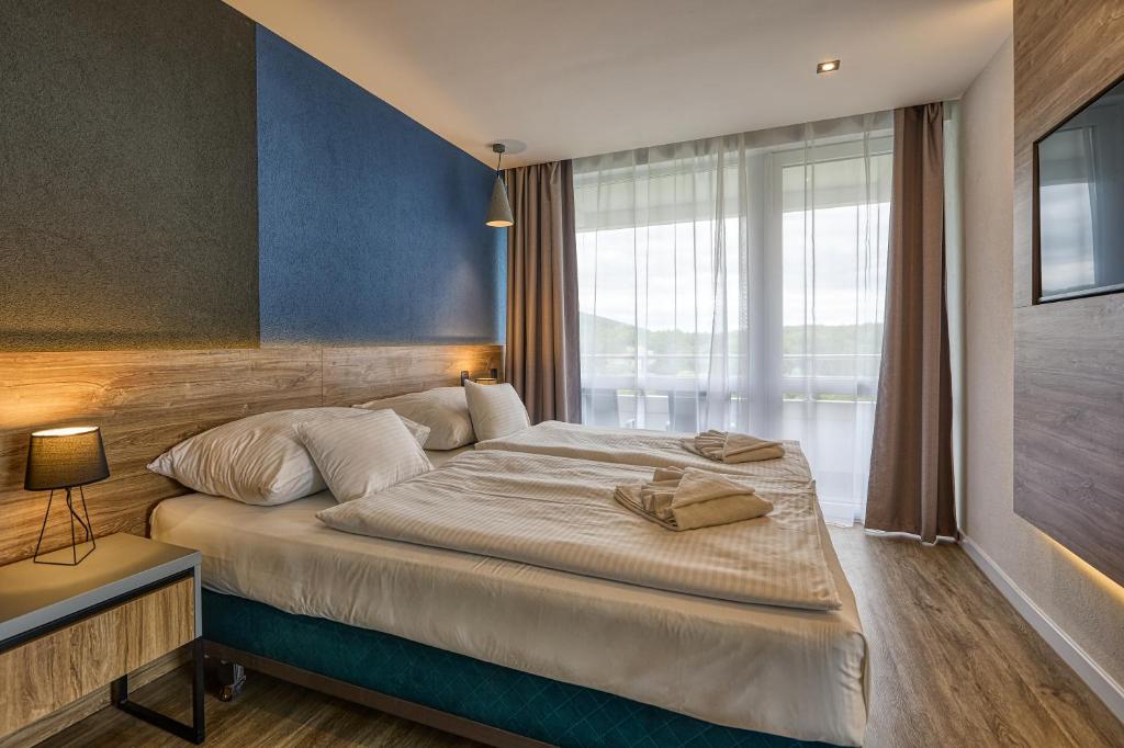 Postel nebo postele na pokoji v ubytování Hotel Szieszta