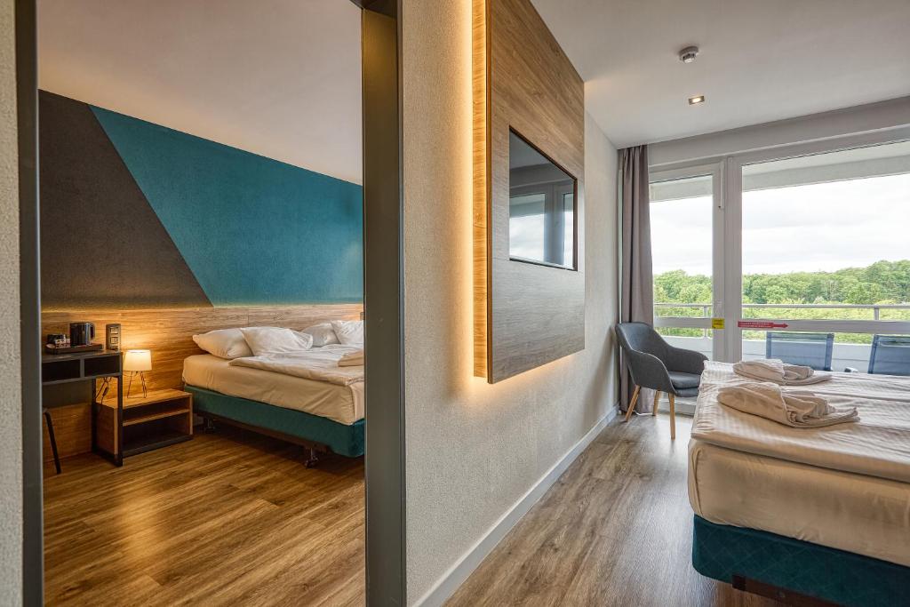 Postel nebo postele na pokoji v ubytování Hotel Szieszta