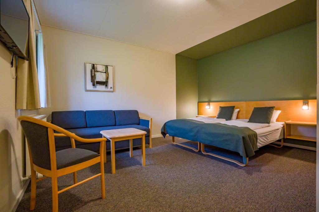 Voodi või voodid majutusasutuse Hotel Hedemarken toas