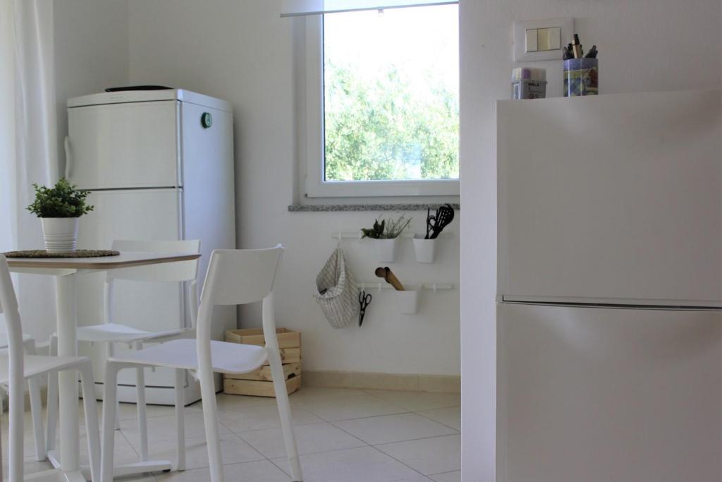 Kuchyňa alebo kuchynka v ubytovaní Cozy Apartment Mediterraneo