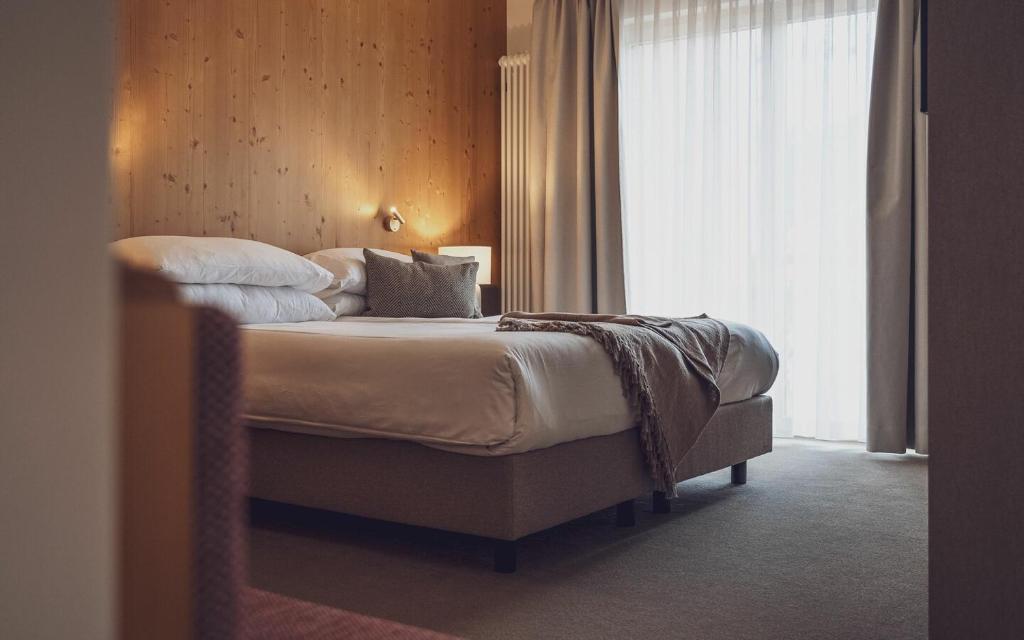 Postel nebo postele na pokoji v ubytování Hotel Waldhuus