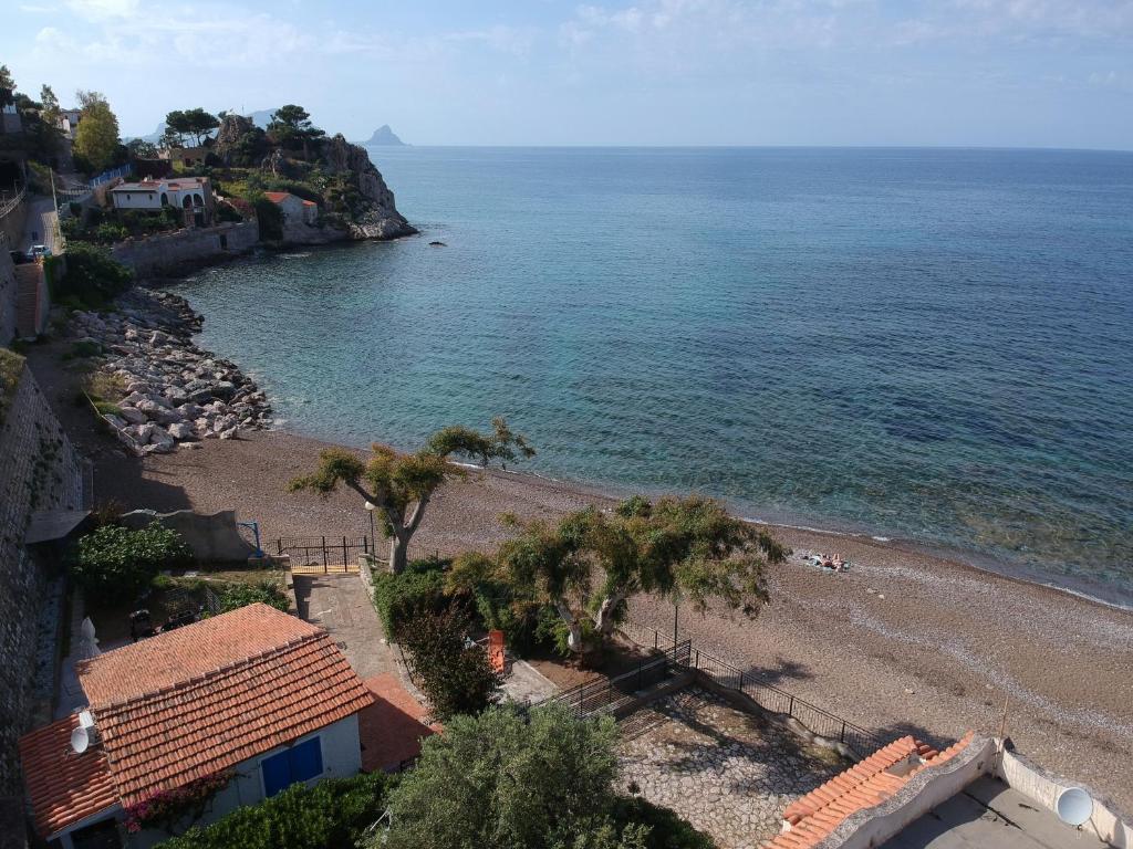 a view of a beach with trees and the ocean at Casa Sulla Spiaggia Villa Eléftheria in Altavilla Milicia