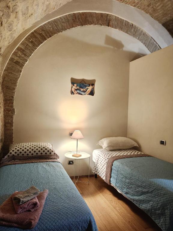 Postel nebo postele na pokoji v ubytování "Il Pollaio" guests house
