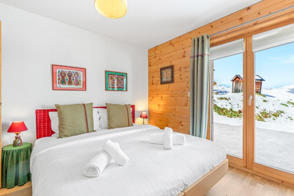 Postel nebo postele na pokoji v ubytování Chalet Magrappe, accès direct à la piste des Mayens de Veysonnaz