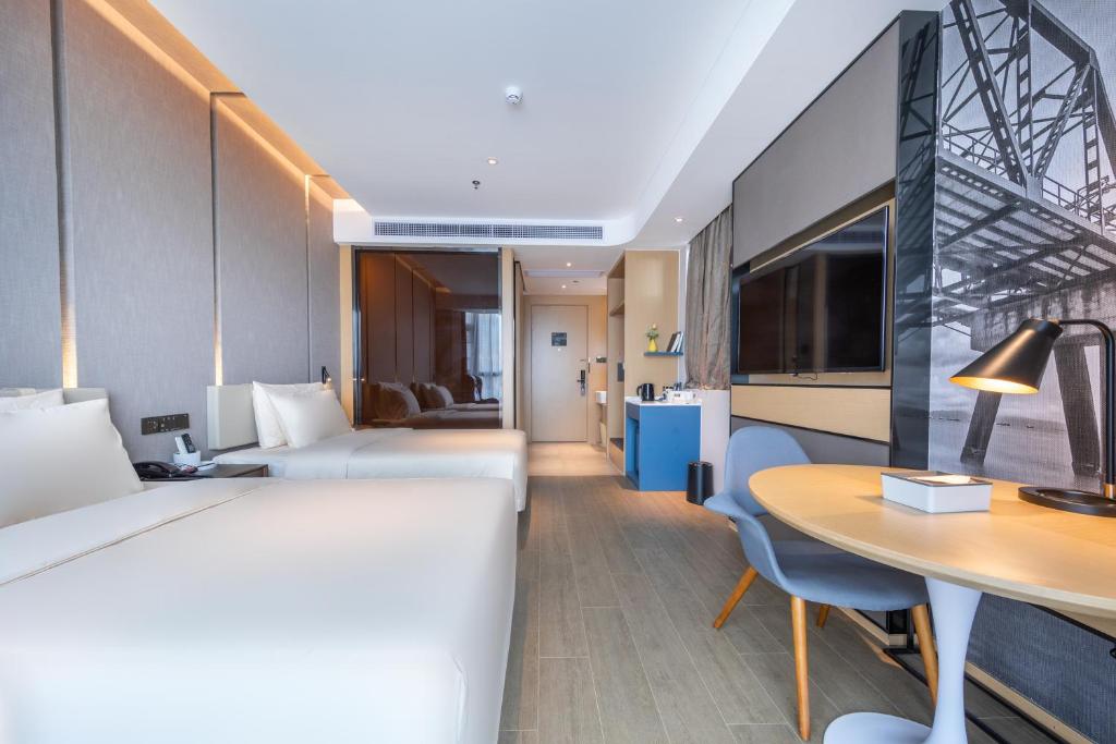 TV a/nebo společenská místnost v ubytování Atour Hotel Shenzhen Huaqiang North