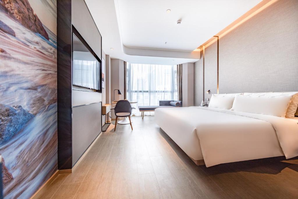 Postel nebo postele na pokoji v ubytování Atour Hotel Shenzhen Huaqiang North