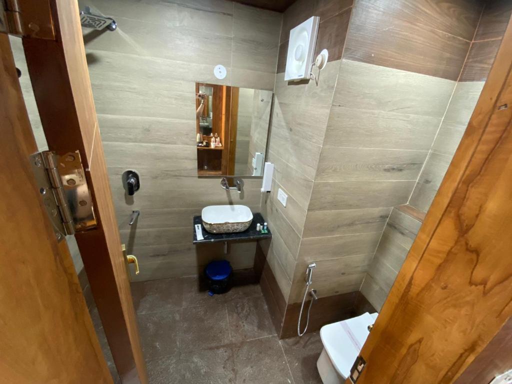 Koupelna v ubytování Rich Grand Hotel