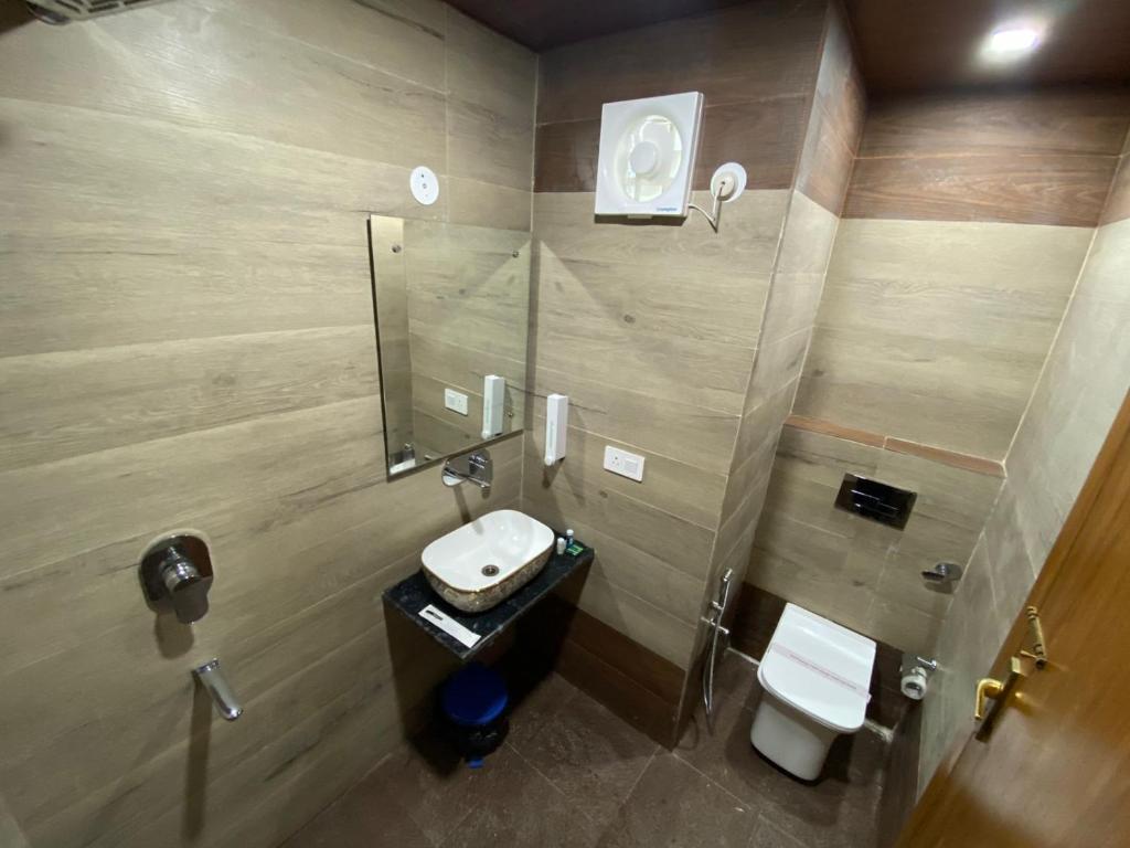 Koupelna v ubytování Rich Grand Hotel