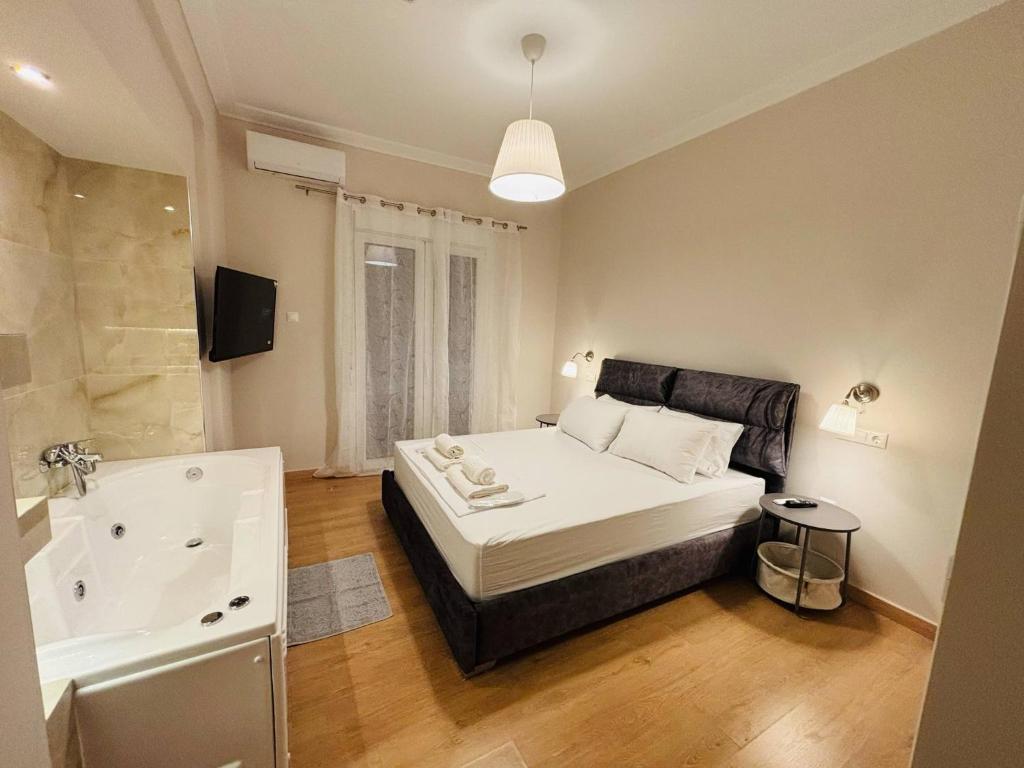 Ένα ή περισσότερα κρεβάτια σε δωμάτιο στο Elysian Αpartment II