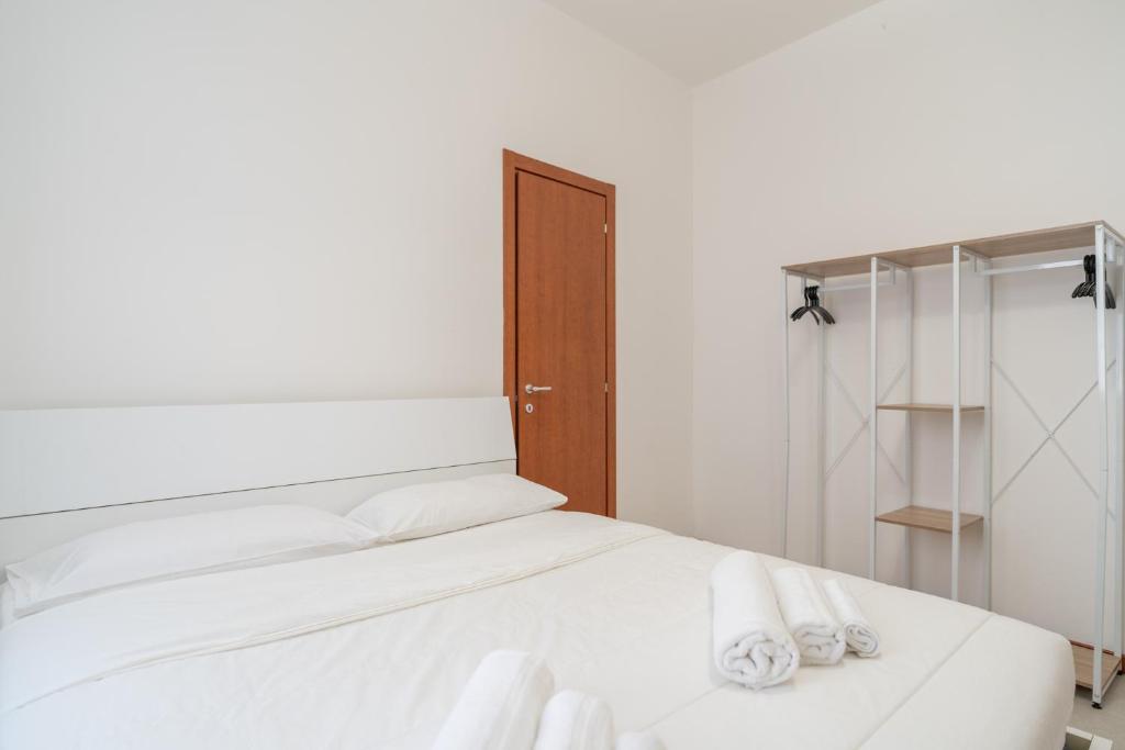 Postel nebo postele na pokoji v ubytování Merate Tre Spade