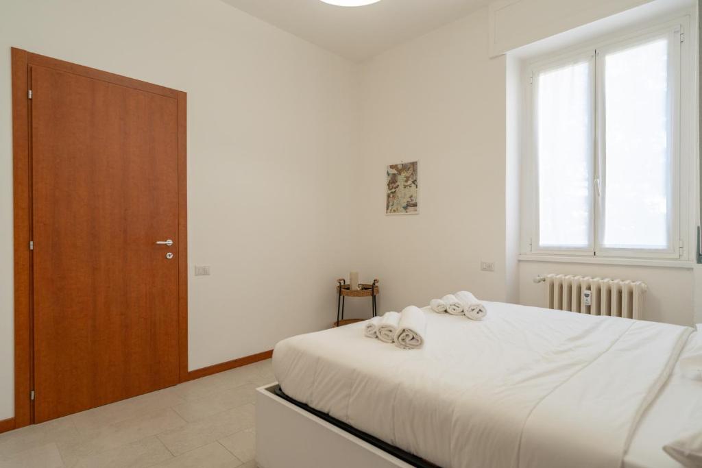 Postel nebo postele na pokoji v ubytování Merate Tre Spade