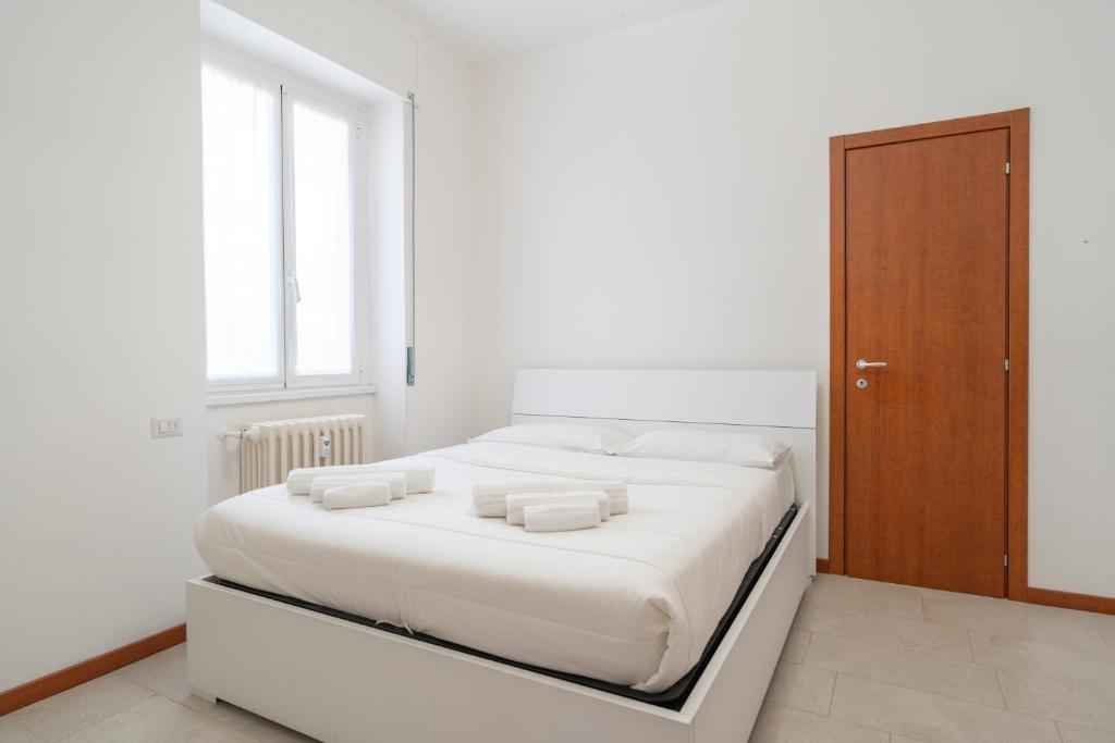 Postel nebo postele na pokoji v ubytování Merate Tre Spade