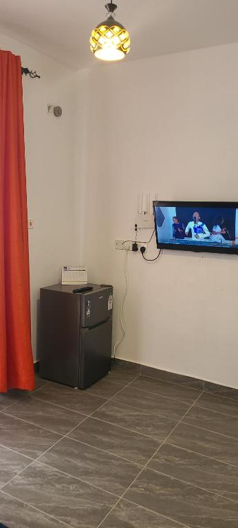 TV a/nebo společenská místnost v ubytování Nestabs Homes