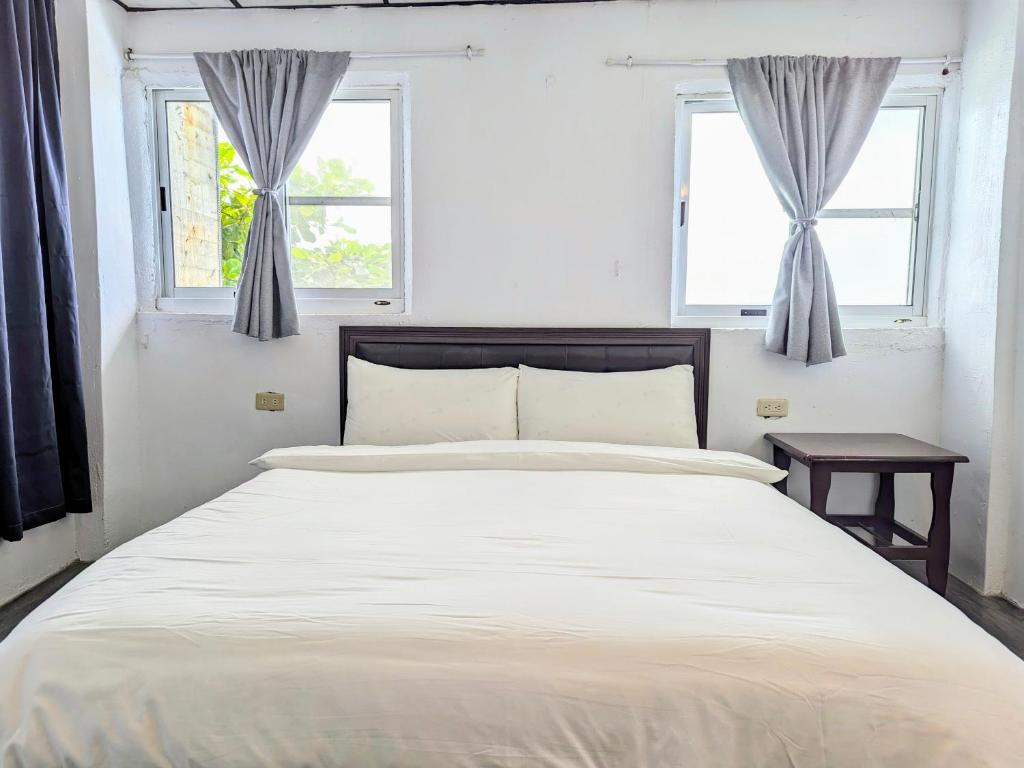 Postel nebo postele na pokoji v ubytování A-Lang Homestay