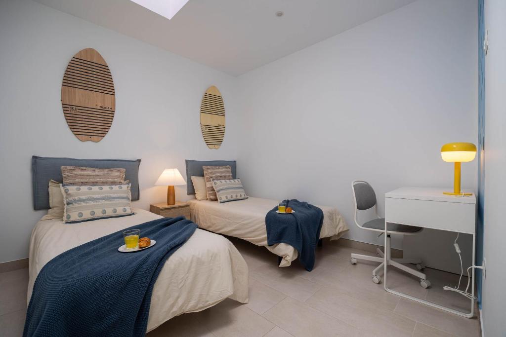 Postel nebo postele na pokoji v ubytování Aire Siroco - Beach Apartment 14