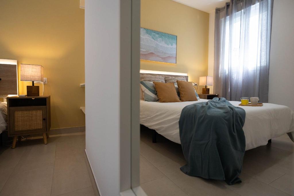 Postel nebo postele na pokoji v ubytování Aire Siroco - Beach Apartment 14