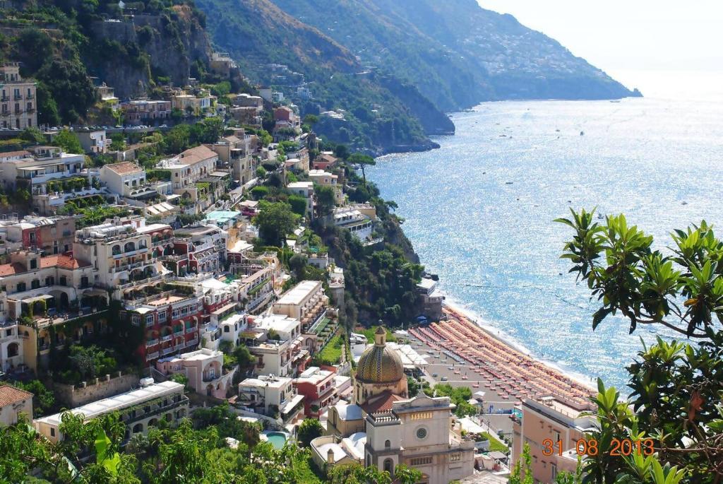 an aerial view of a town next to the water at A casa dei Sasso vista mare mozzafiato in Positano