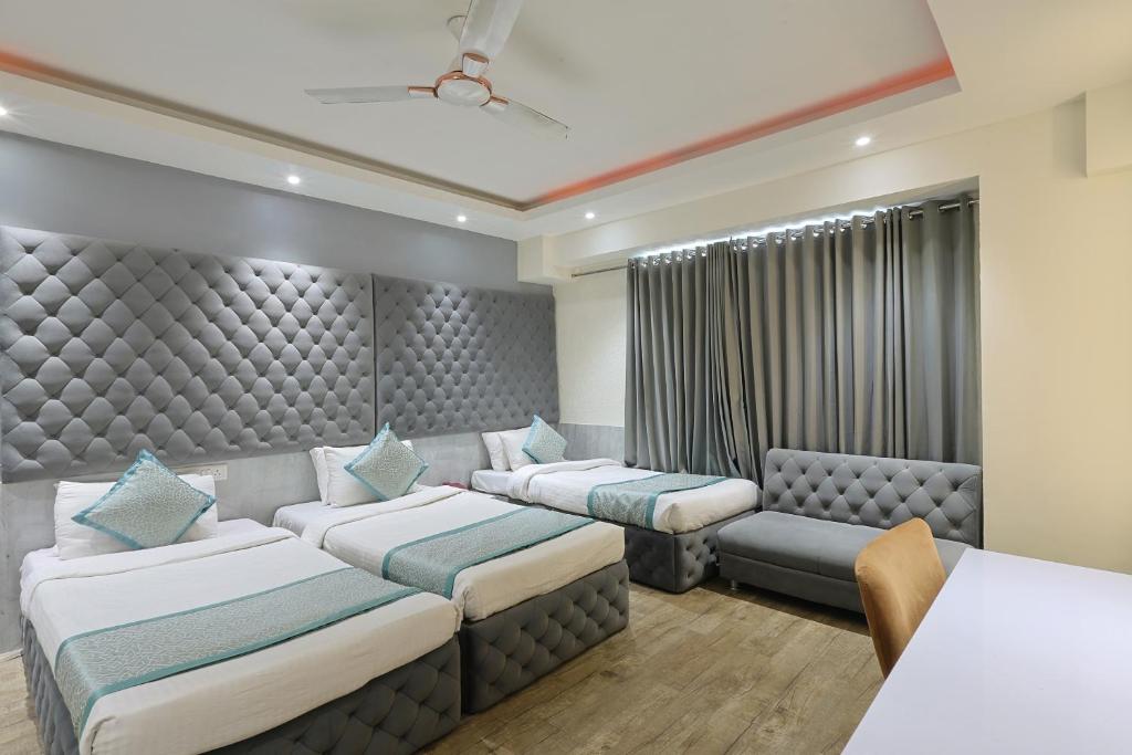 Postel nebo postele na pokoji v ubytování Hotel VENUE INN