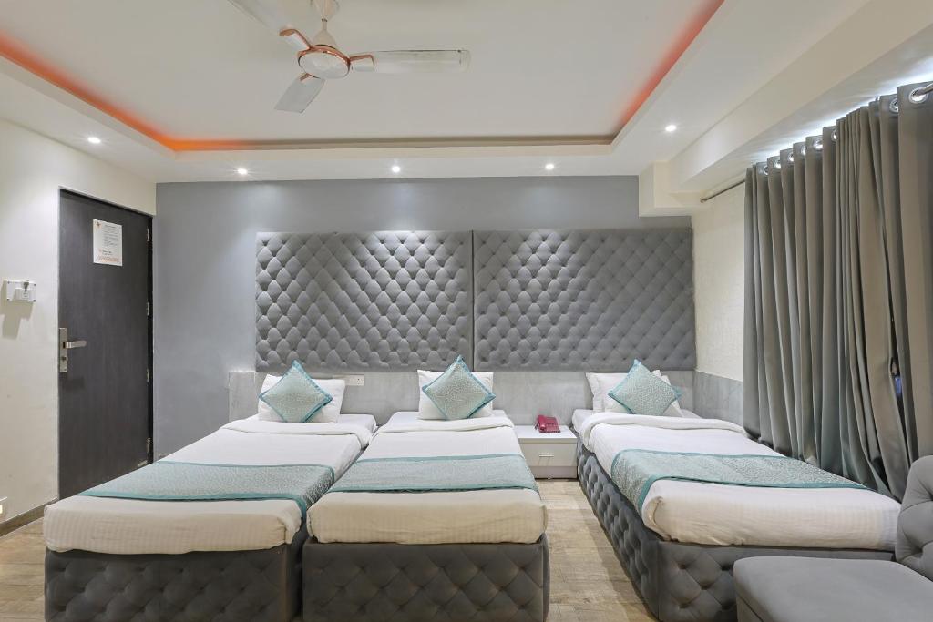 Postel nebo postele na pokoji v ubytování Hotel VENUE INN