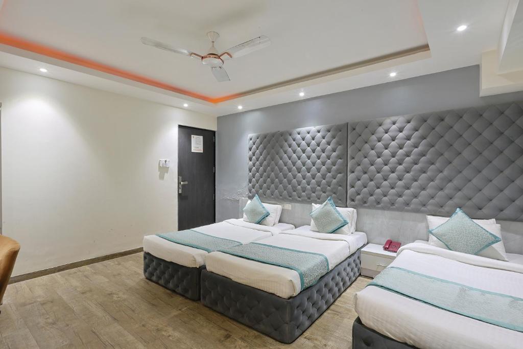 Postel nebo postele na pokoji v ubytování Hotel VENUE INN