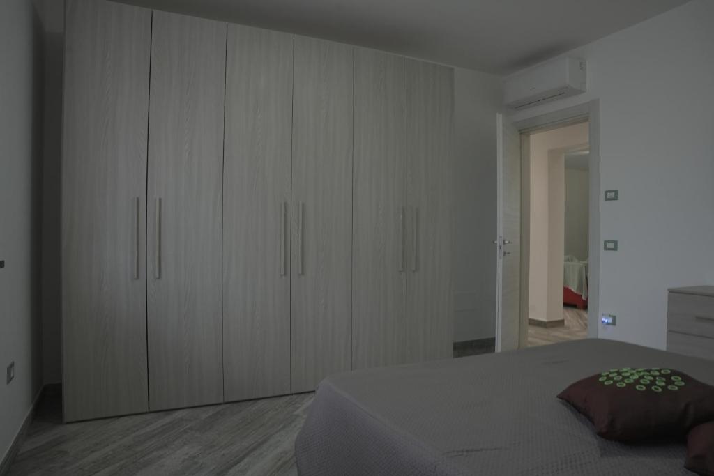 Postel nebo postele na pokoji v ubytování L'ANGOLO VERDE