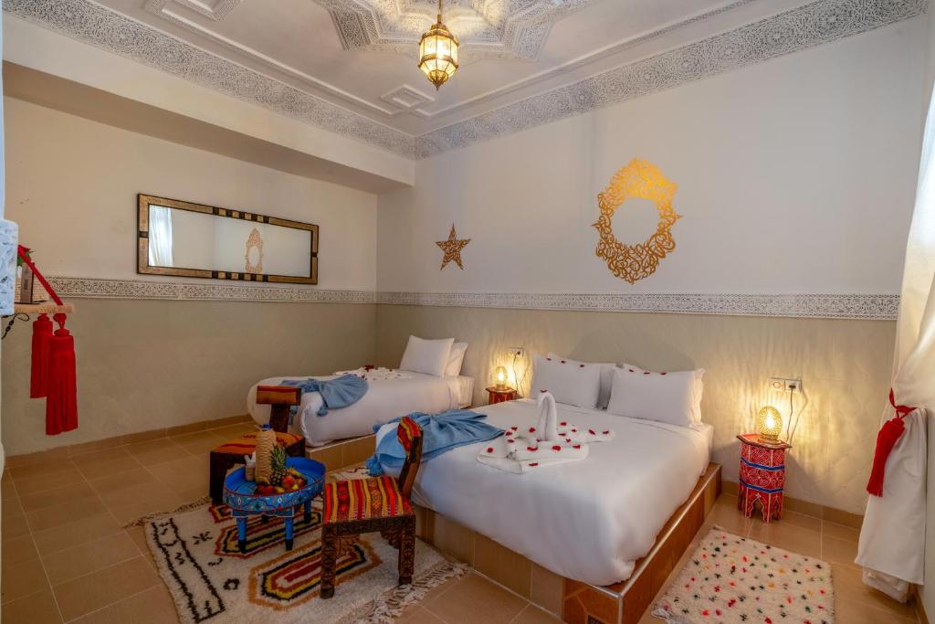 Postel nebo postele na pokoji v ubytování Palais Moulay Said & SPA