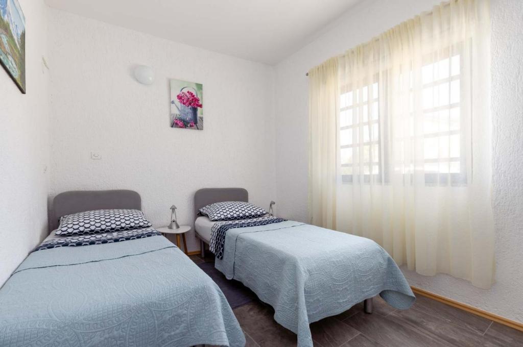 Posteľ alebo postele v izbe v ubytovaní Dvi Ulike