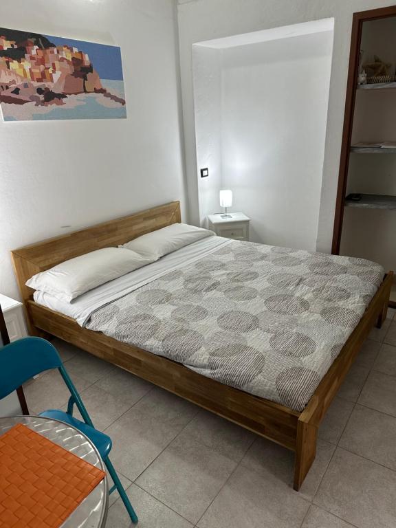 Postel nebo postele na pokoji v ubytování Affittacamere l'Acciuga