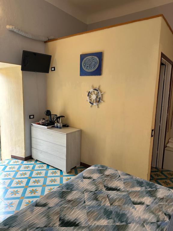 Postel nebo postele na pokoji v ubytování Affittacamere l'Acciuga