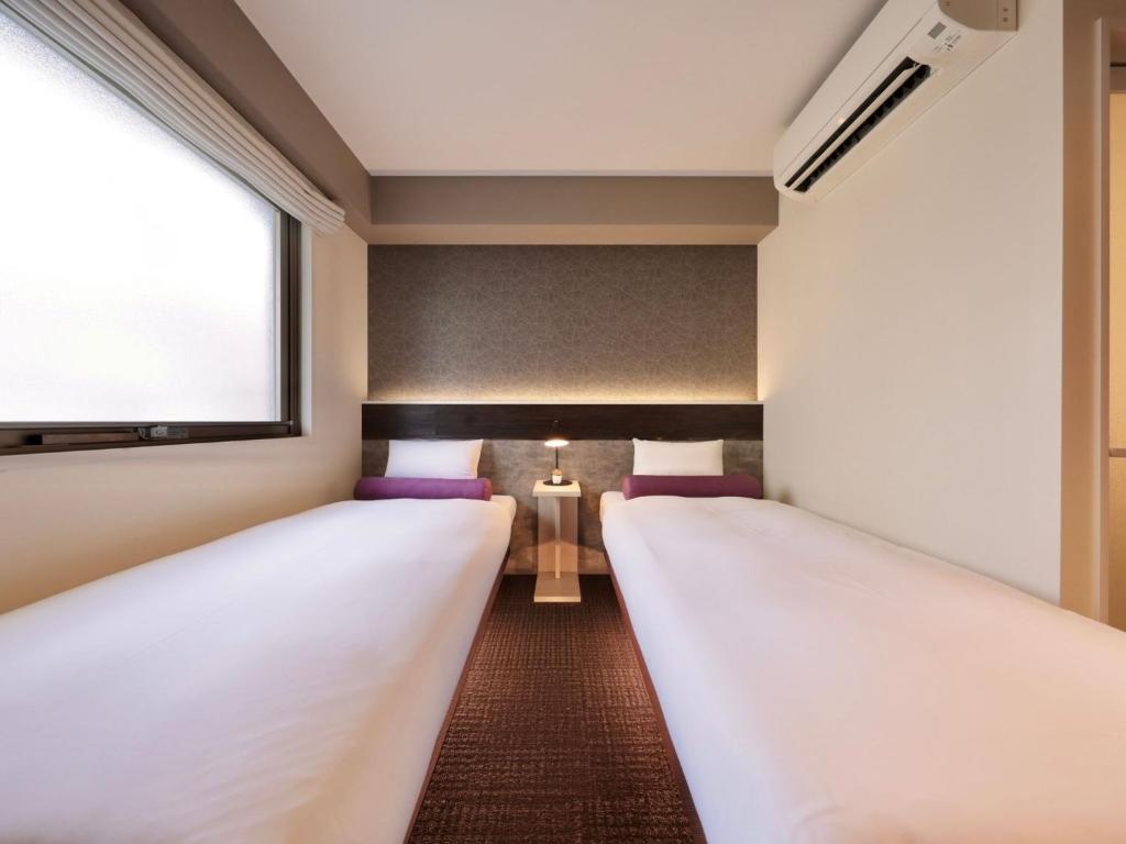 Ένα ή περισσότερα κρεβάτια σε δωμάτιο στο Dotonbori Crystal Hotel II - Vacation STAY 90067v