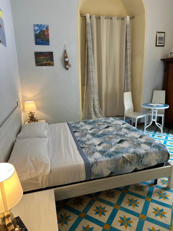 Postel nebo postele na pokoji v ubytování Affittacamere l'Acciuga