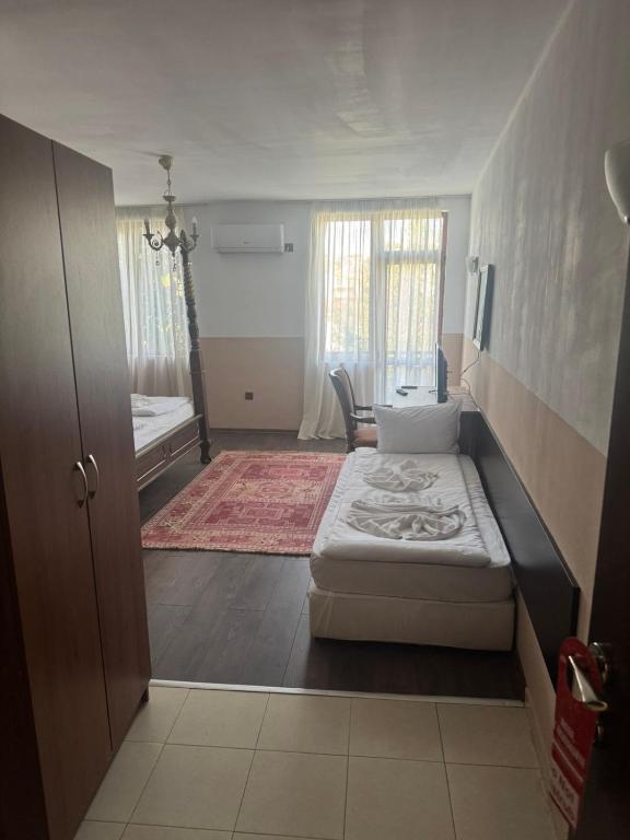 Postel nebo postele na pokoji v ubytování Комлекс Кристо