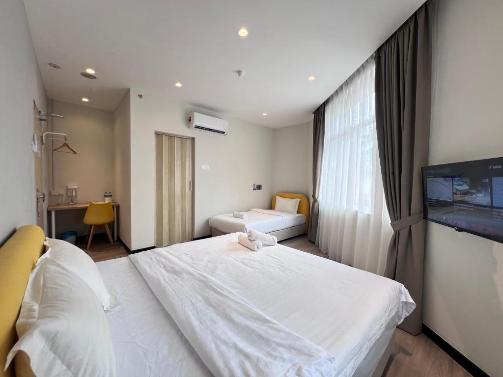 Postel nebo postele na pokoji v ubytování Havona Hotel - CIQ Johor Bahru - Self Check-In