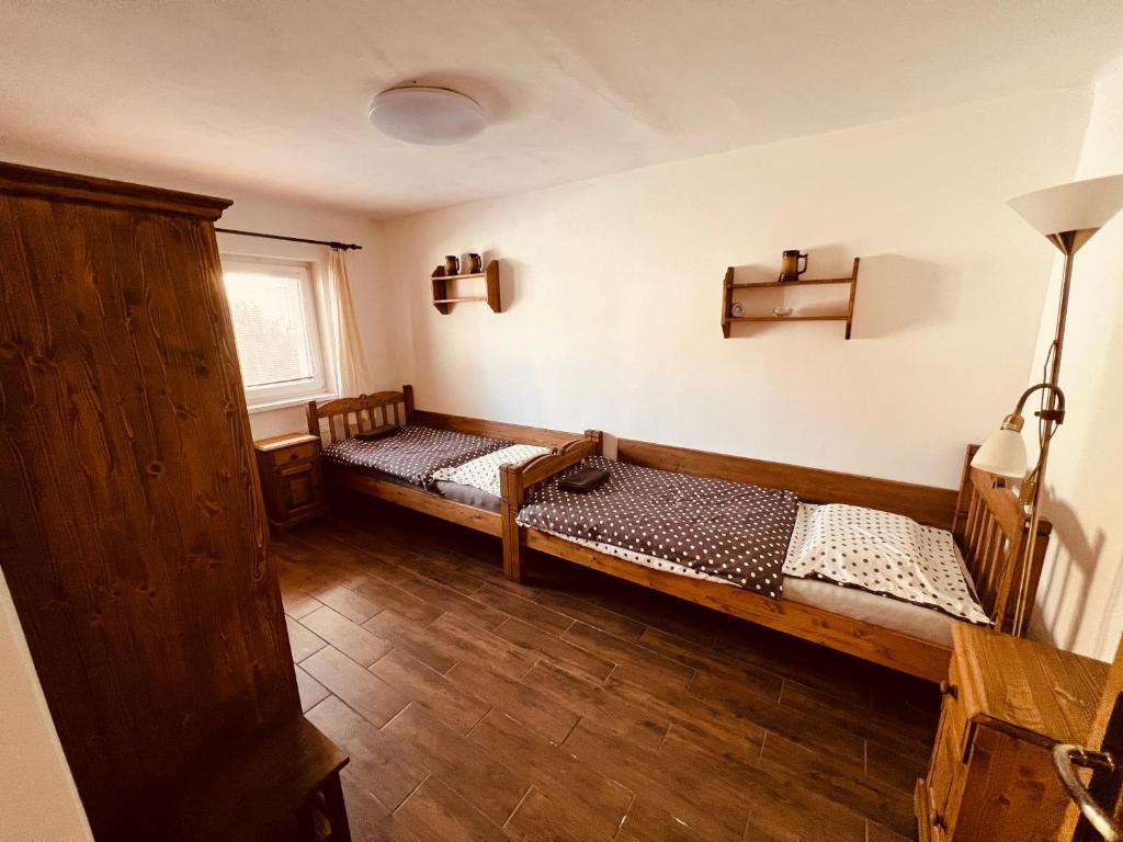 Postel nebo postele na pokoji v ubytování Penzion Na Růžku