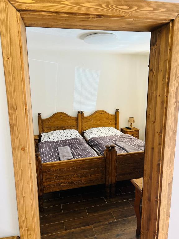 Postel nebo postele na pokoji v ubytování Penzion Na Růžku
