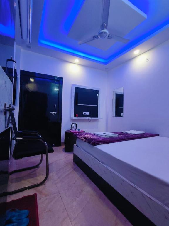 Postel nebo postele na pokoji v ubytování Ram Lok Palace