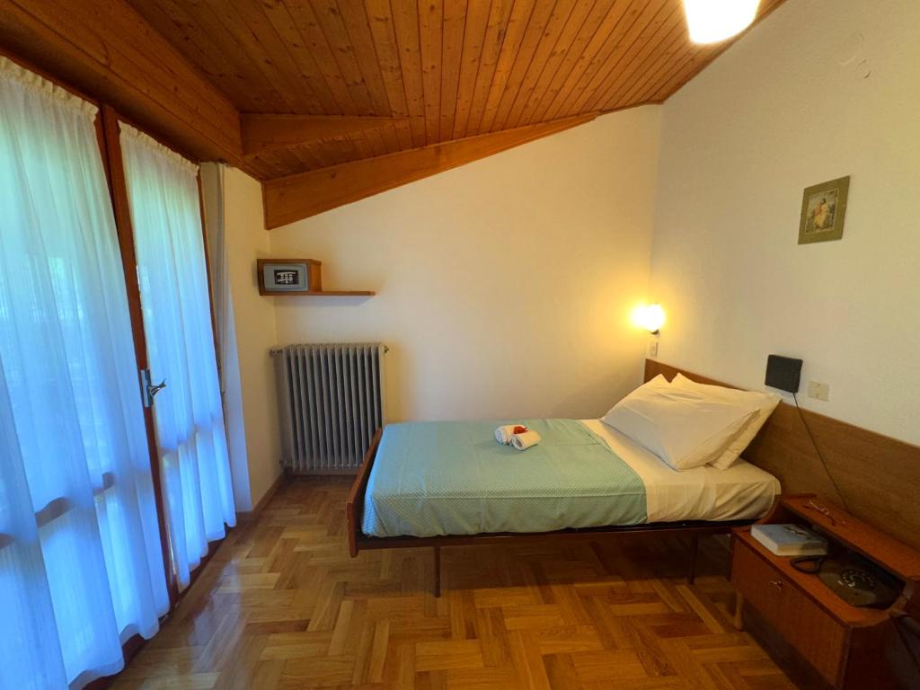 Postel nebo postele na pokoji v ubytování Hotel Excelsior