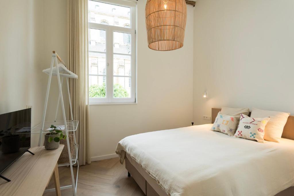 Postel nebo postele na pokoji v ubytování NOX Logies, vakantiewoning en polyvalente ruimte