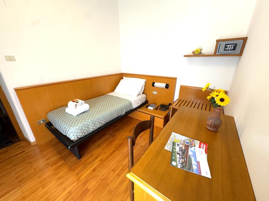 Postel nebo postele na pokoji v ubytování Hotel Excelsior
