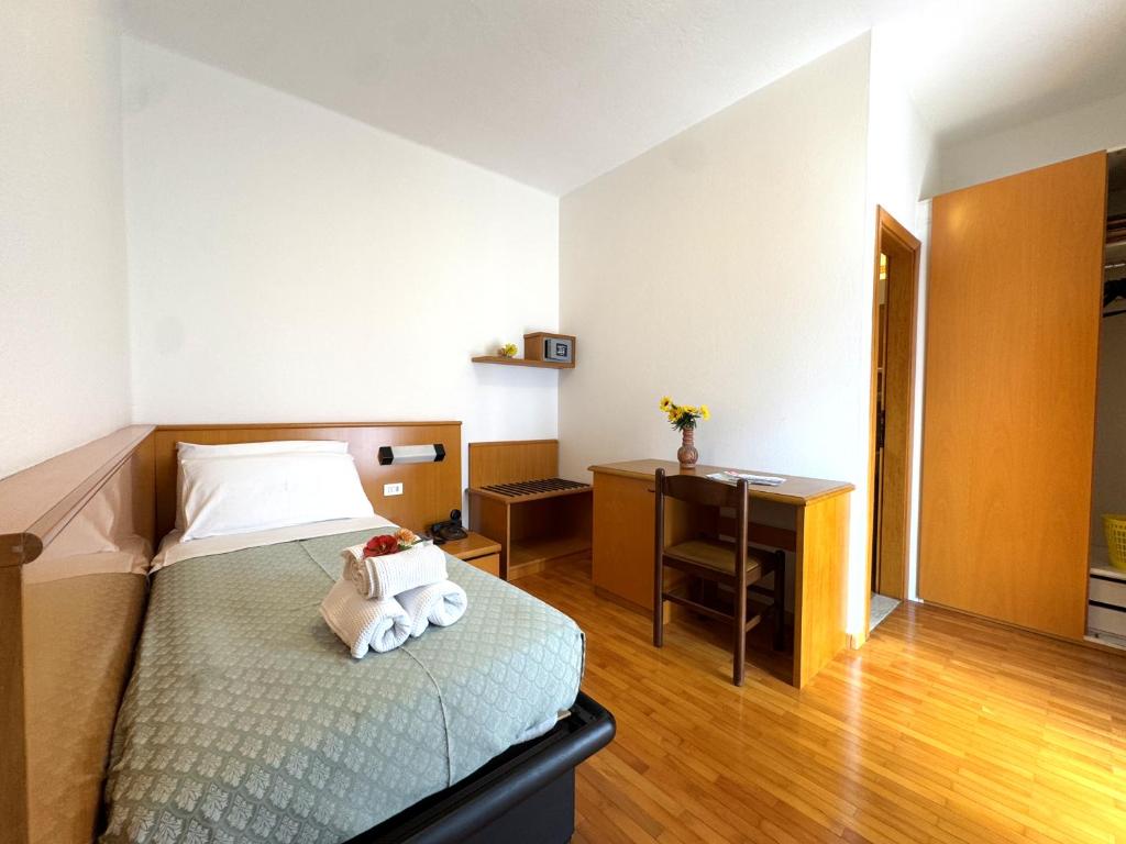 Postel nebo postele na pokoji v ubytování Hotel Excelsior