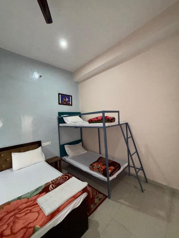 Voodi või voodid majutusasutuse Hotel Shree Ram toas
