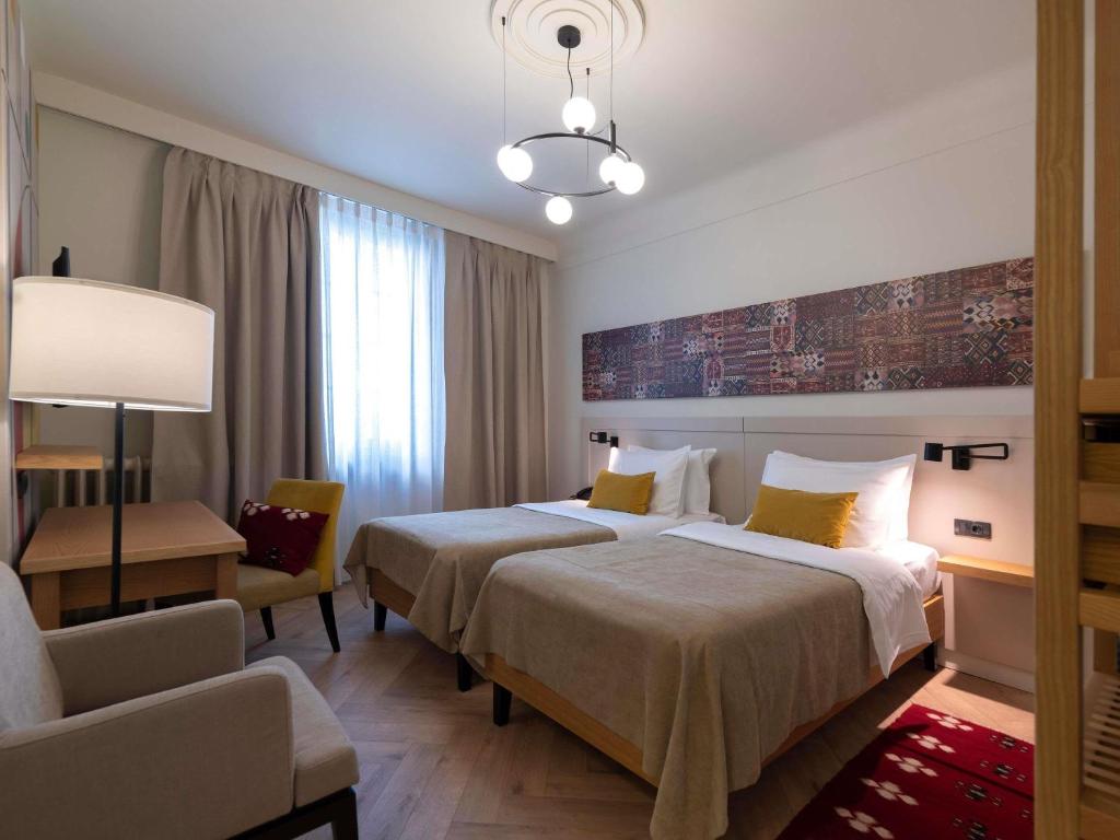 Postel nebo postele na pokoji v ubytování Mercure Belgrade Excelsior