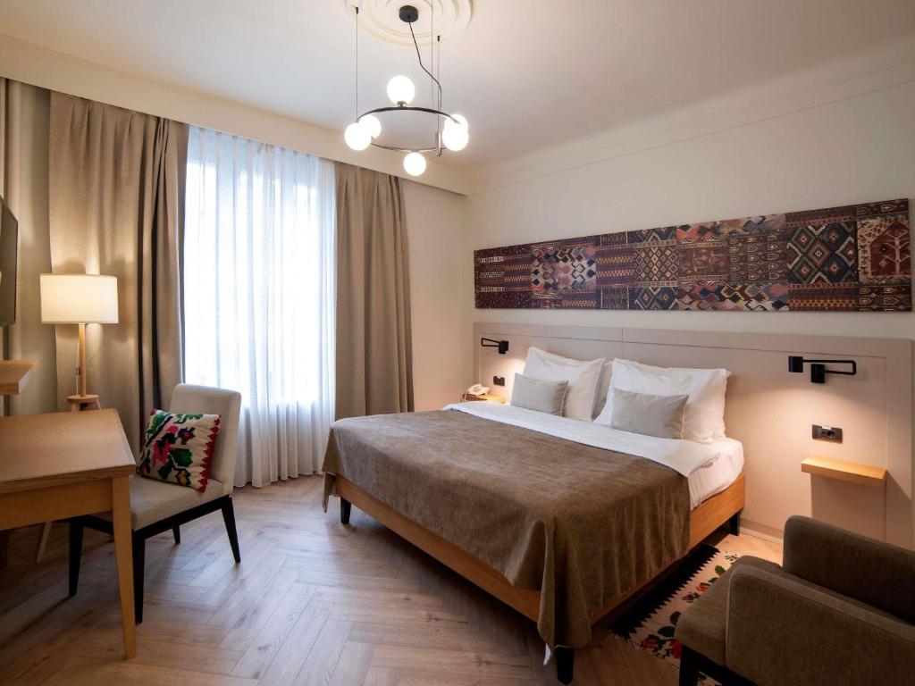 Postel nebo postele na pokoji v ubytování Mercure Belgrade Excelsior